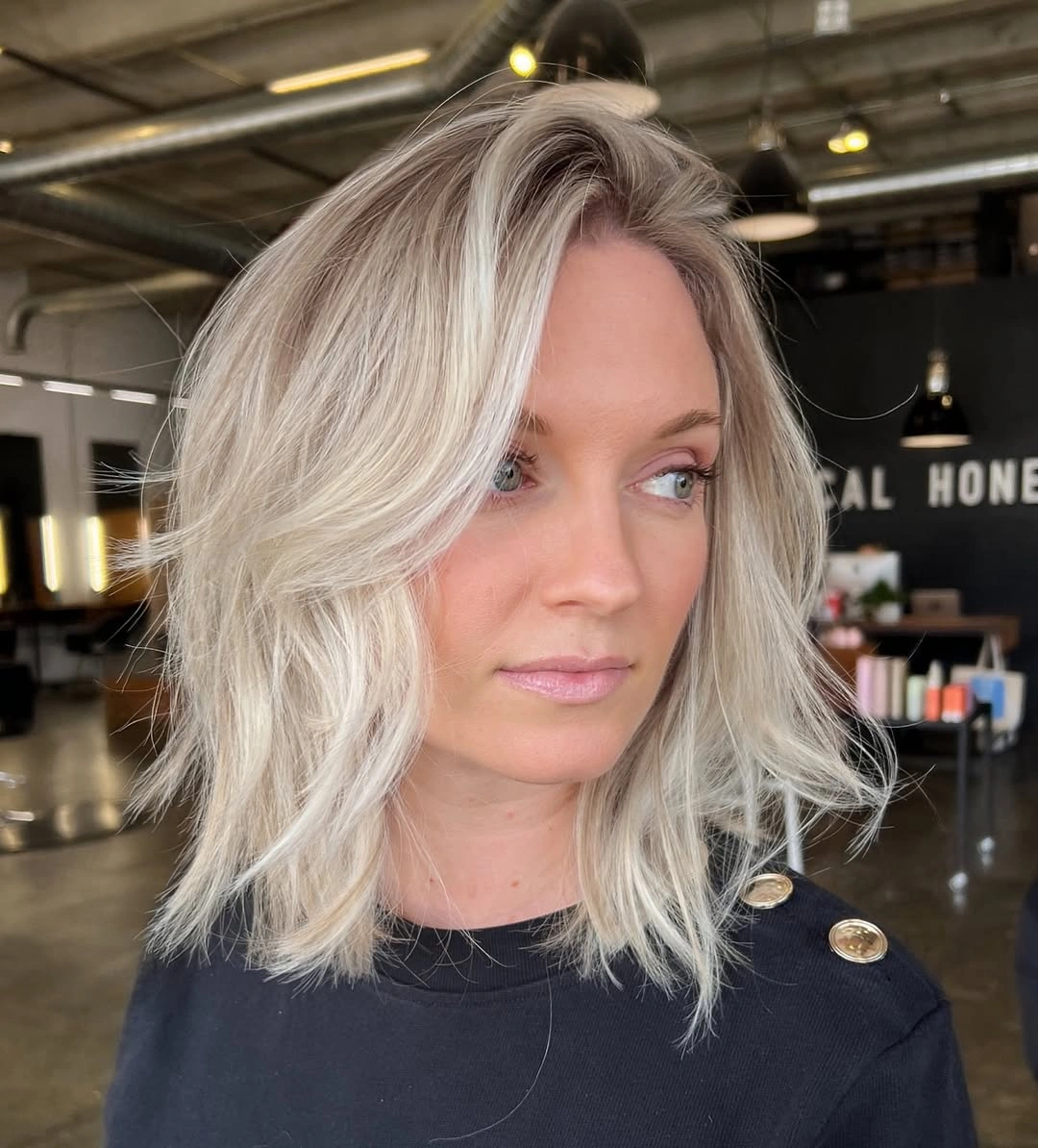 fall bob haircut ideas 2026 Layered Platinum Bob With Feathered Movement