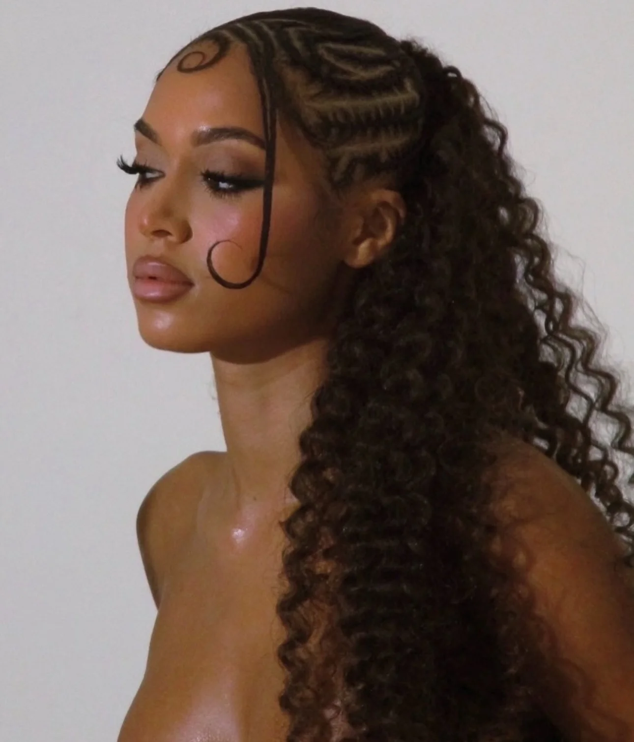 fall hair colors for black women 2026 Defined Curly Ponytail With Sleek Sculpted Details