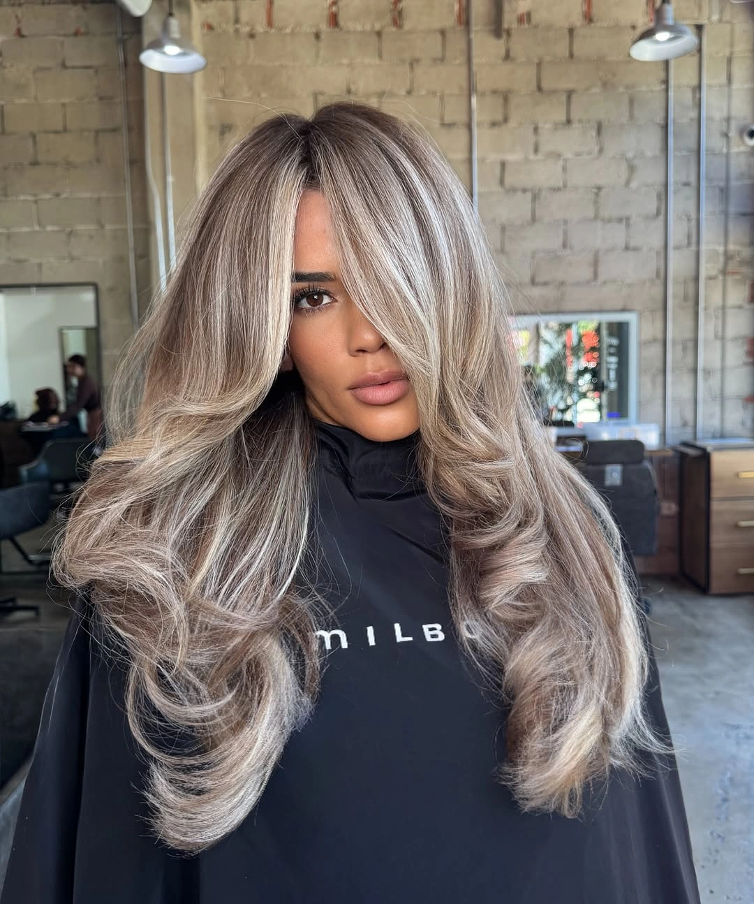 fall haircuts for women 2026 Voluminous Butterfly Layers with Cool Beige Blonde