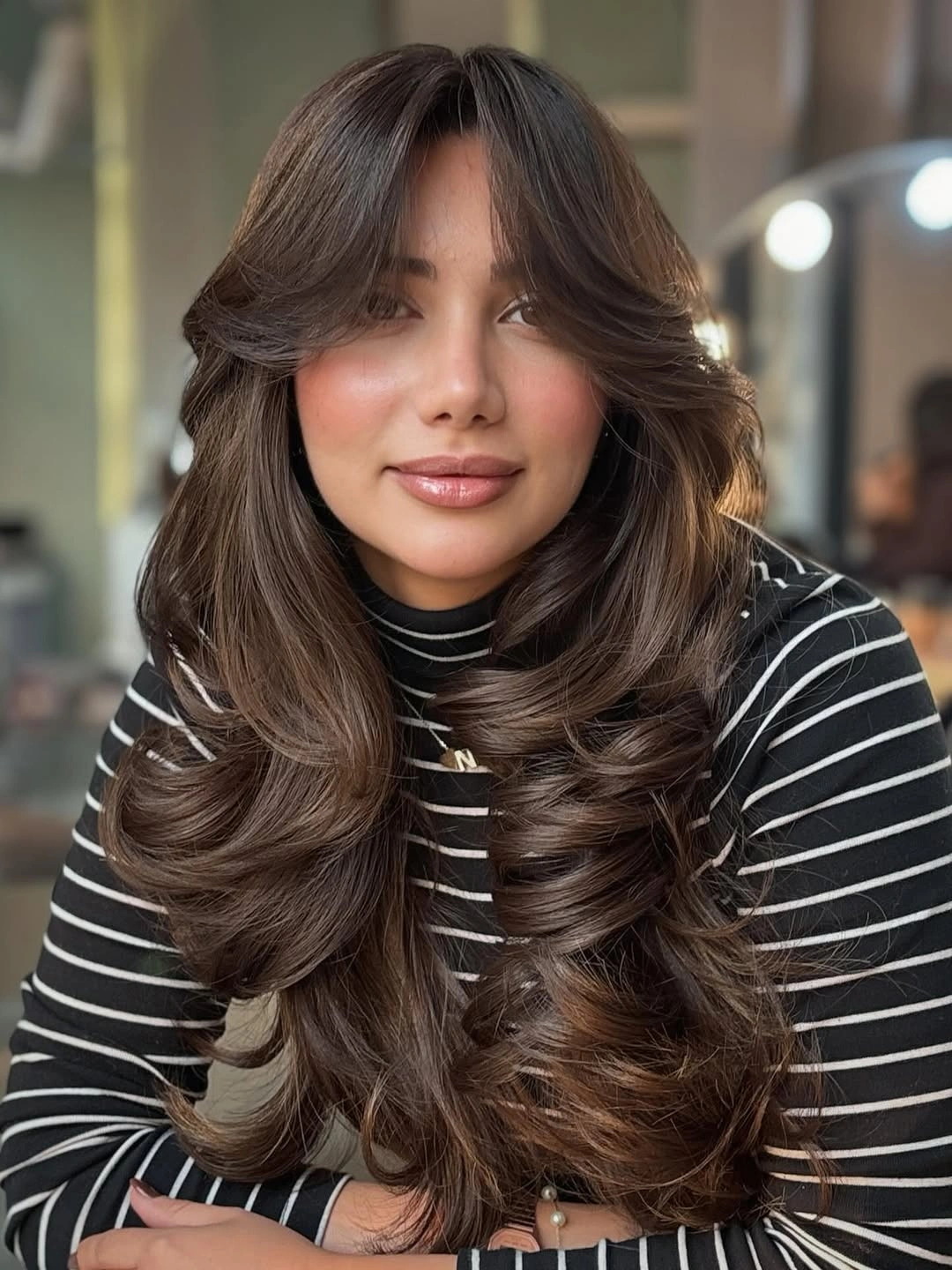 fall haircuts for women 2026 Voluminous Espresso Layers with Curtain Bangs