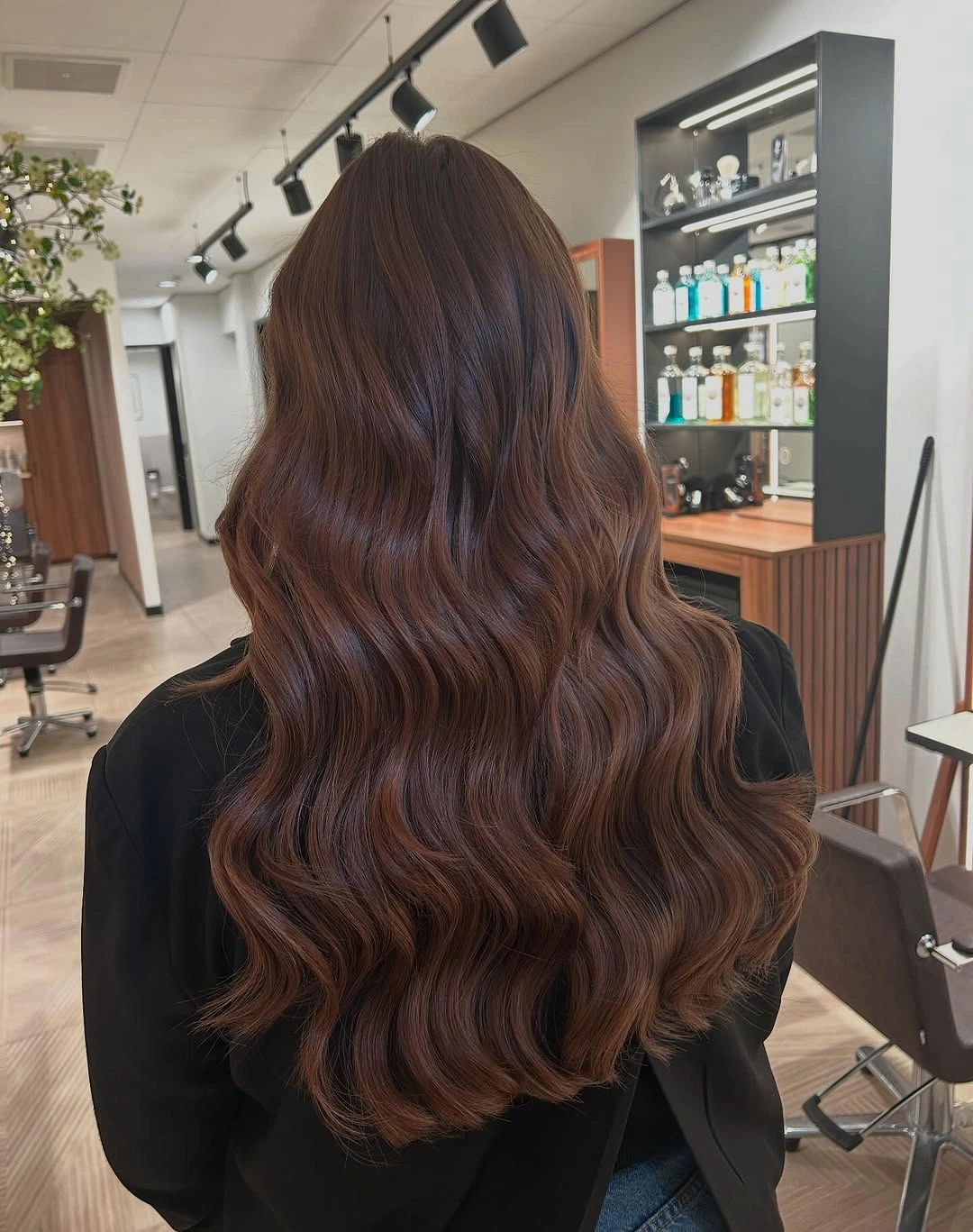 fall haircuts for women 2026 Glossy Chocolate Layers with Luxurious Movement