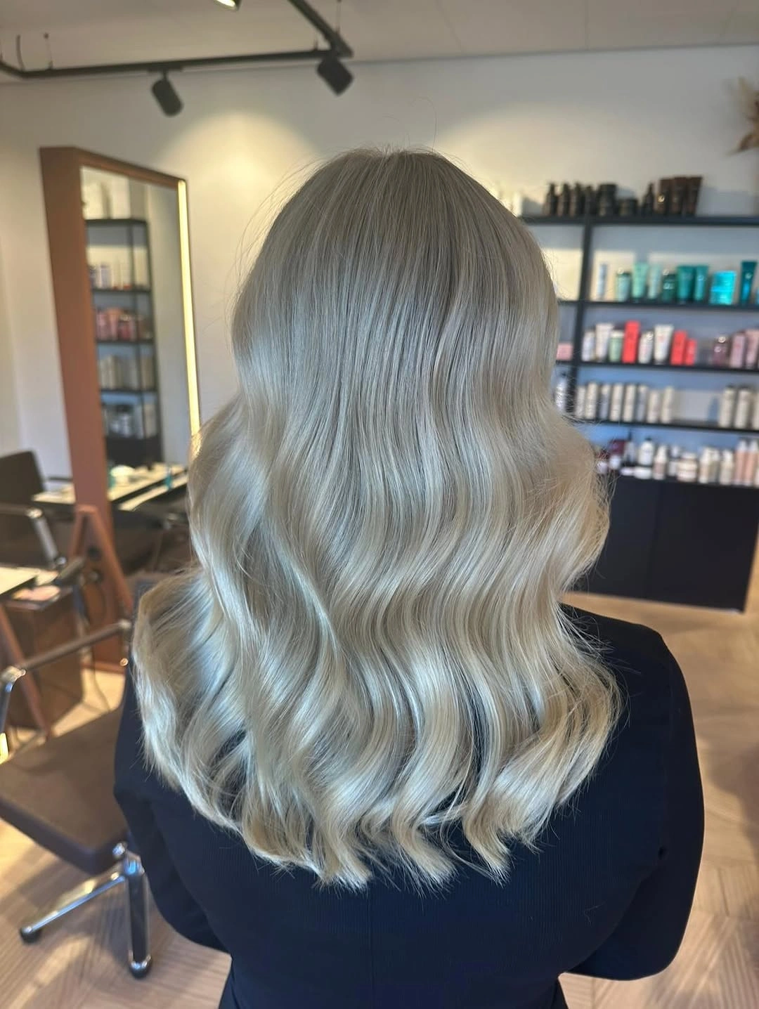 fall haircuts for women 2026 Soft Pearl Blonde Waves That Brighten Fall Days