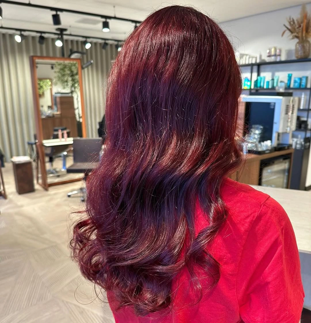 fall haircuts for women 2026 Rich Burgundy Waves for a Bold Seasonal Refresh