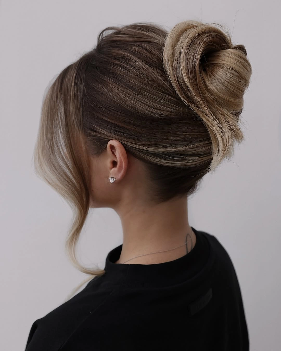 fall hairstyles 2026 Elegant Twisted Low Bun for Busy Autumn Days