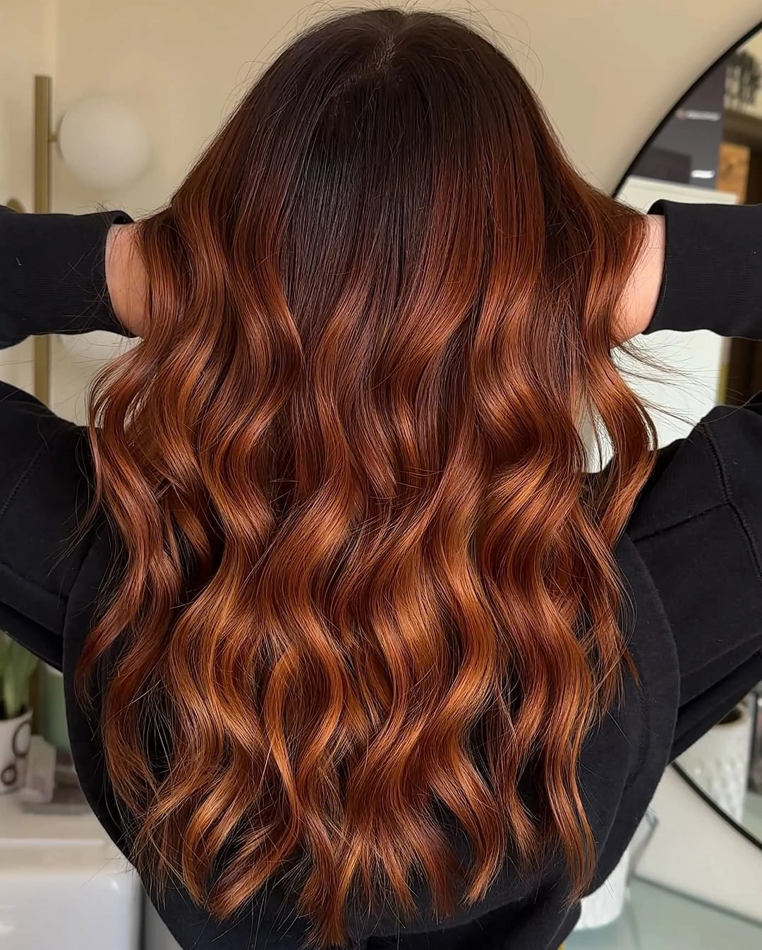 fall hairstyles 2026 Glossy Cinnamon Waves With Luxurious Autumn Dimension