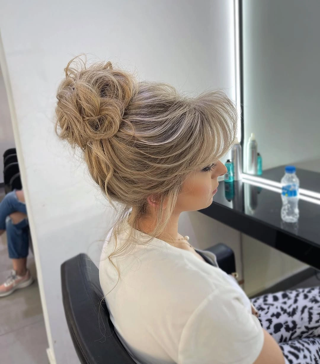 fall hairstyles 2026 Soft Textured Messy Bun With Romantic Volume