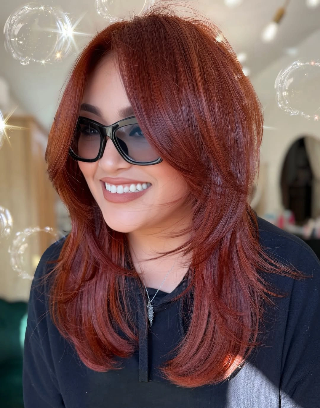 fall hairstyles 2026 Rich Auburn Feathered Layers With a Modern Blowout Finish