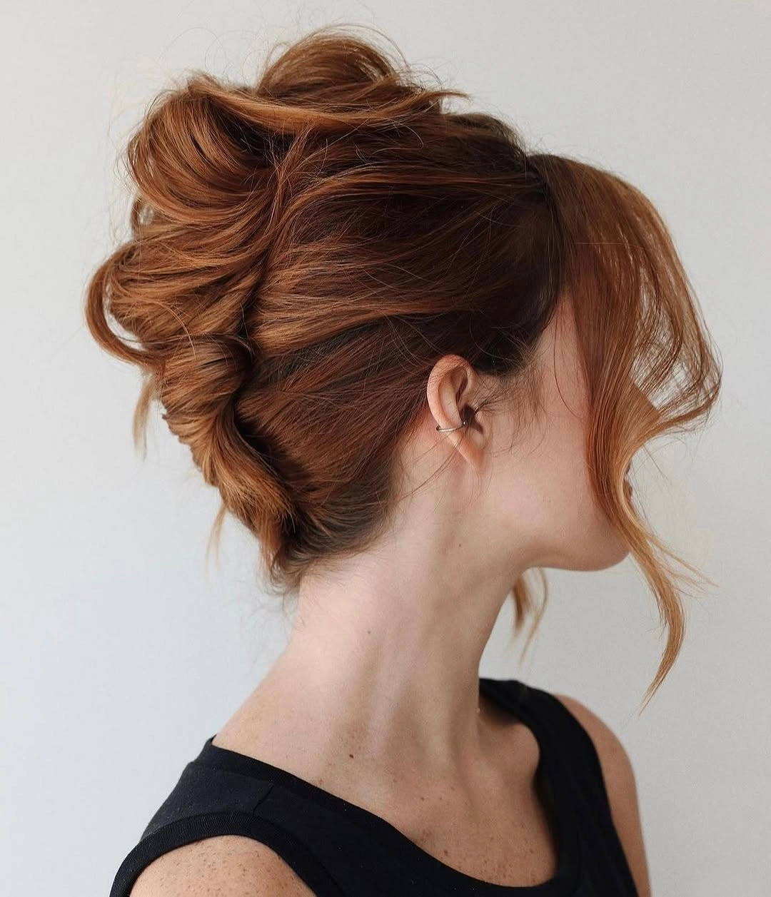 fall hairstyles for long hair 2026 Soft Ginger French Twist With Wispy Face-Framing Pieces