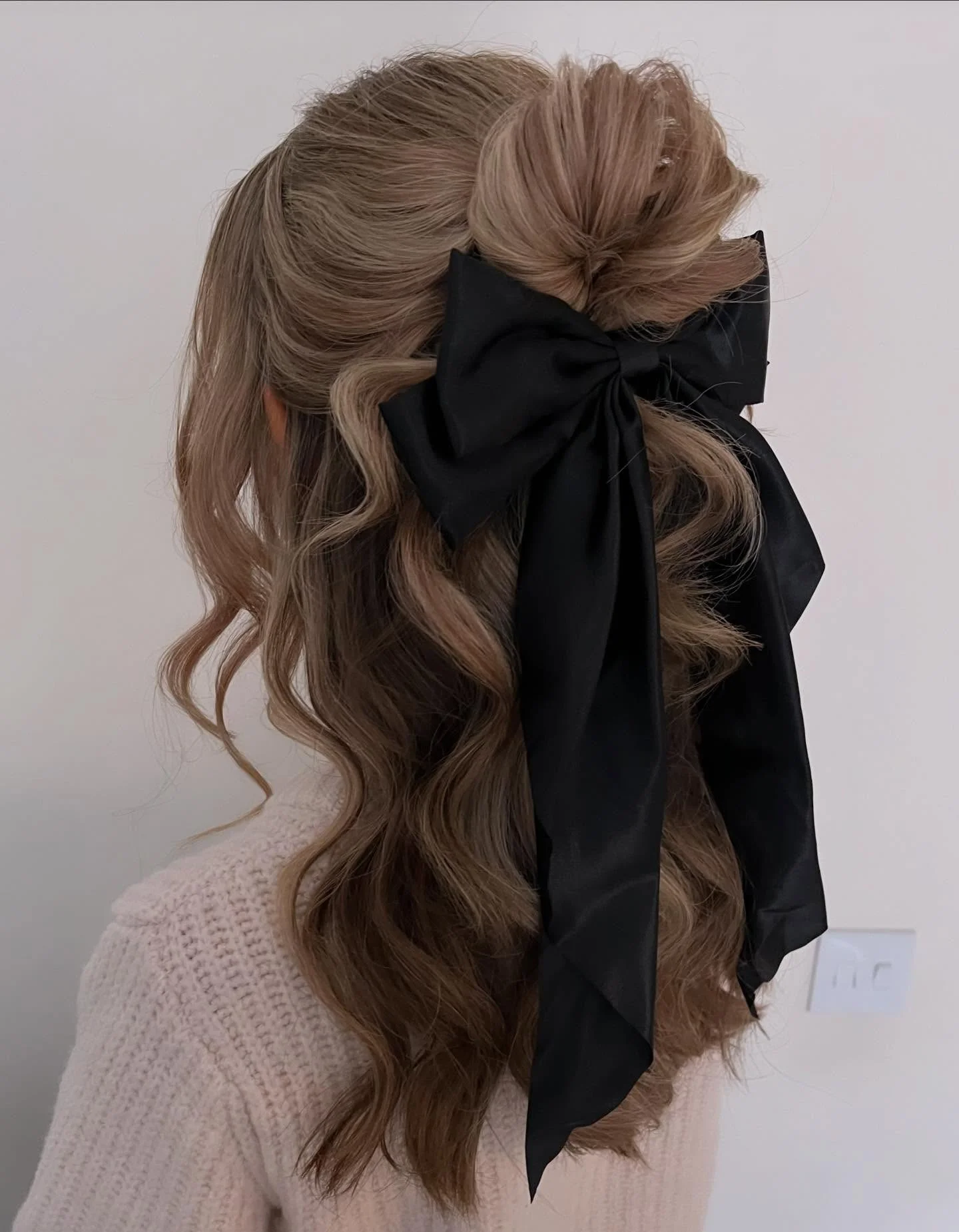 Fall hairstyles for office 2026 Elegant Half-Up Twist with a Statement Black Bow