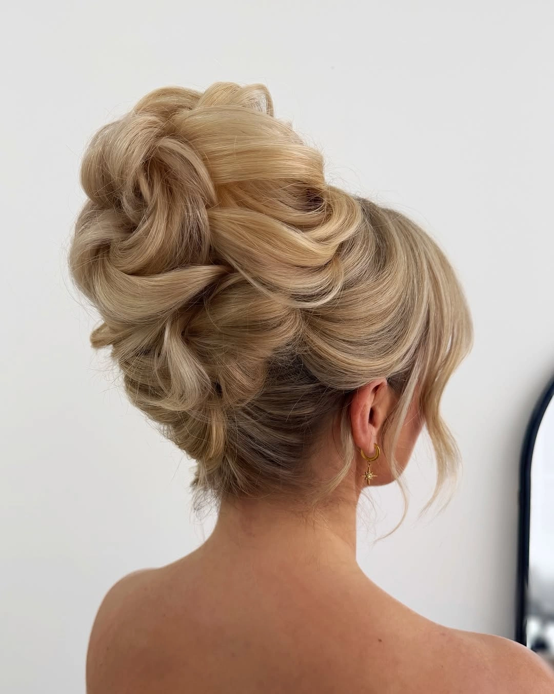 Fall hairstyles for office 2026 Voluminous Blonde French Twist Updo for Executive Elegance
