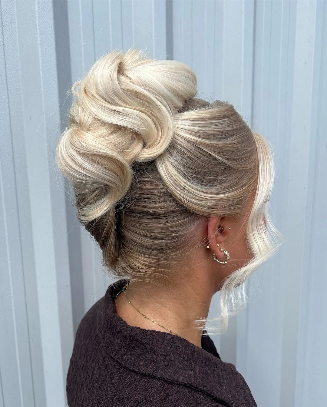 Fall hairstyles for office 2026 Sculpted Blonde Office Bun with Soft Vintage Waves