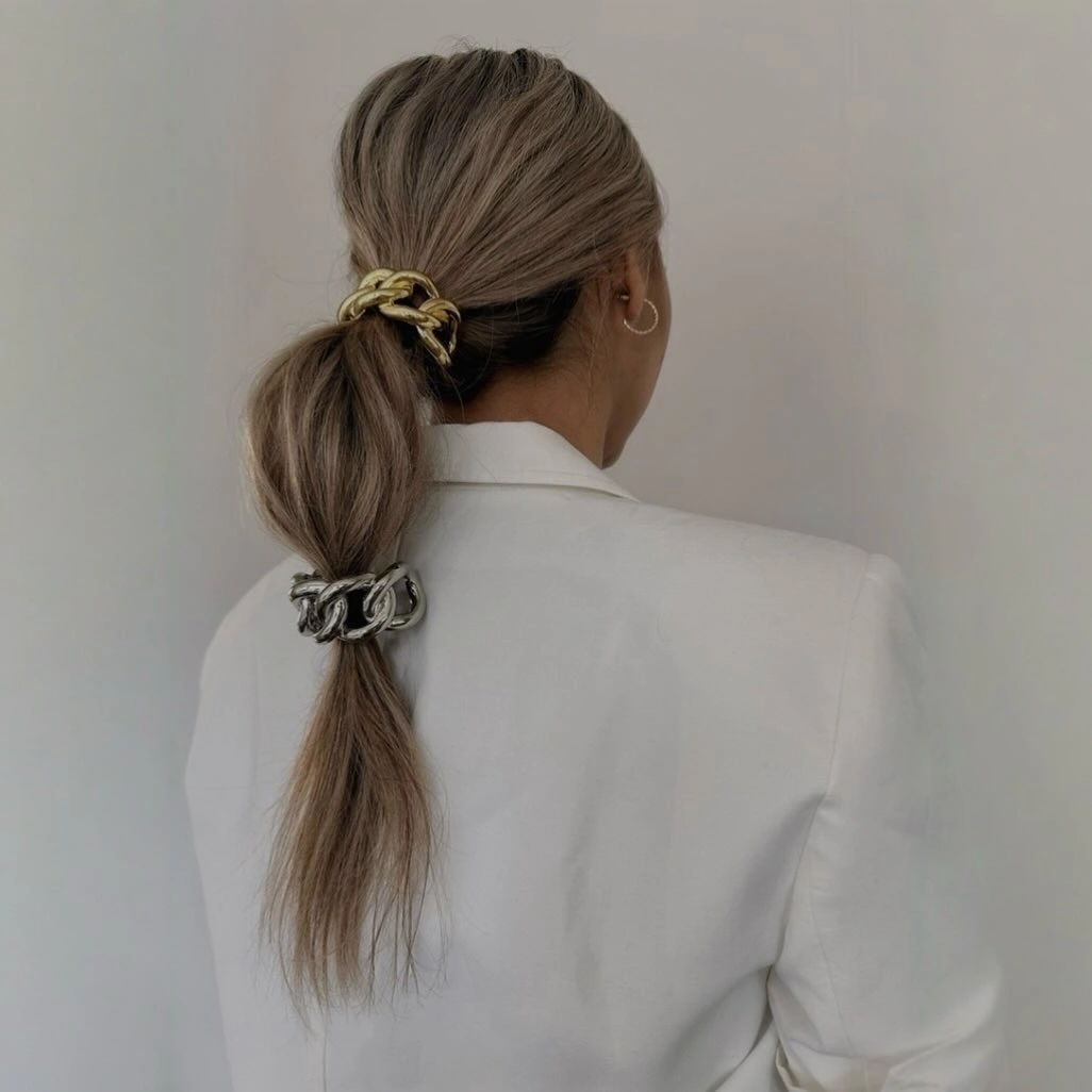 Fall hairstyles for office 2026 Minimalist Double Ponytail with Modern Gold Accessories