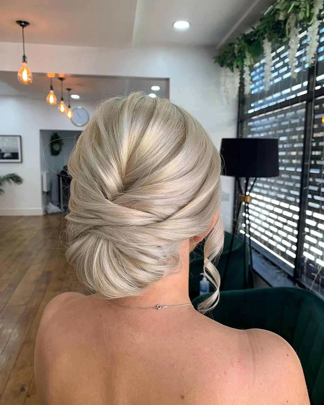Fall hairstyles for office 2026 Low Twisted Chignon for Timeless Professional Style