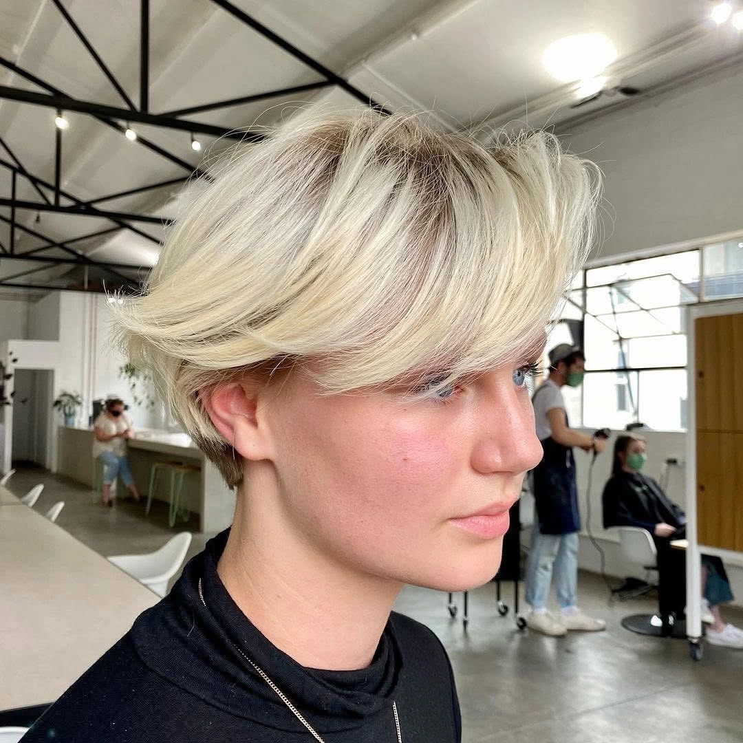 Fall hairstyles for short hair 2026 Voluminous Blonde Bixie with Flipped-Out Layers