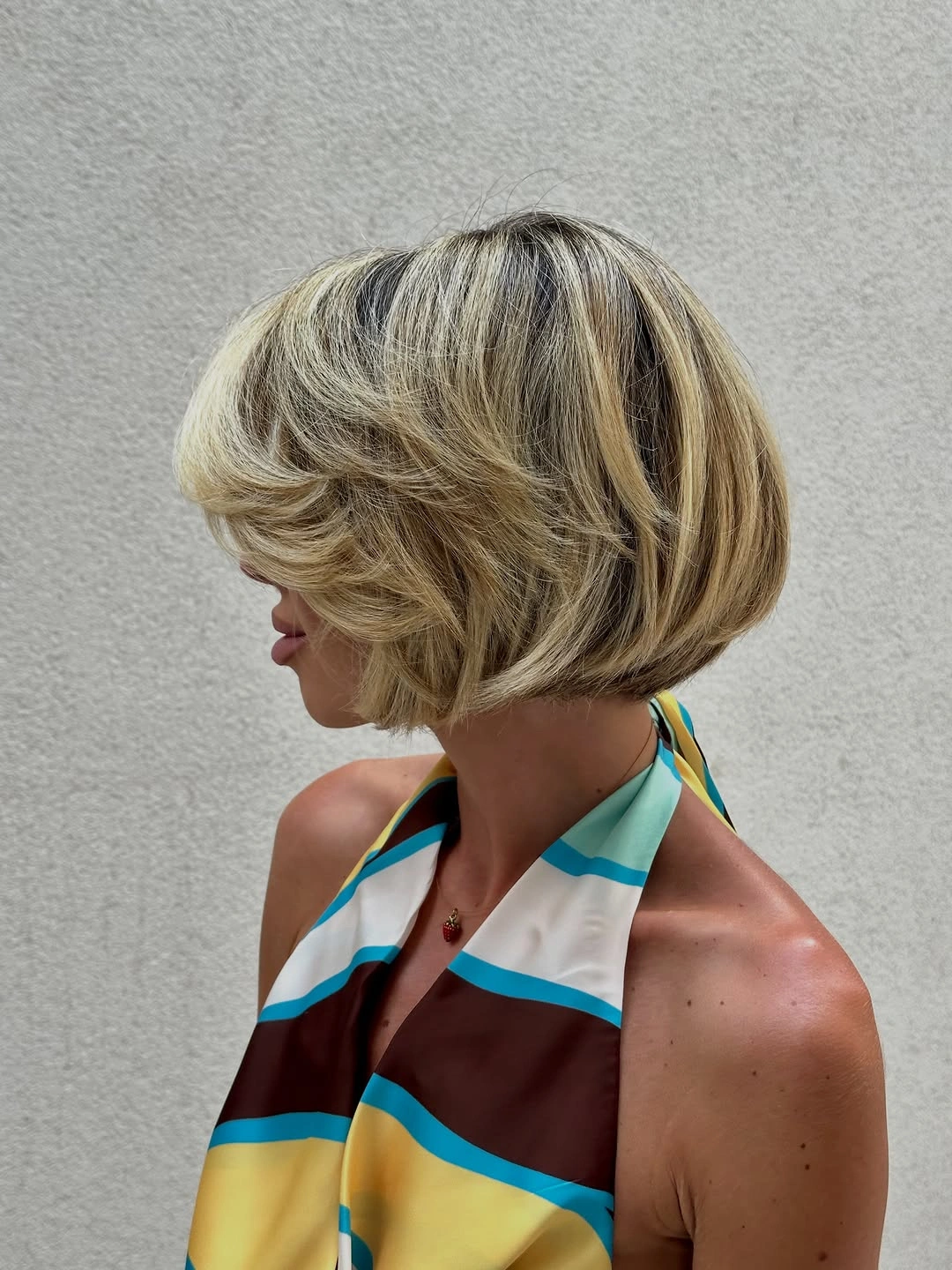 Fall hairstyles for short hair 2026 Layered Butterfly Bob with Dimensional Blonde Highlights