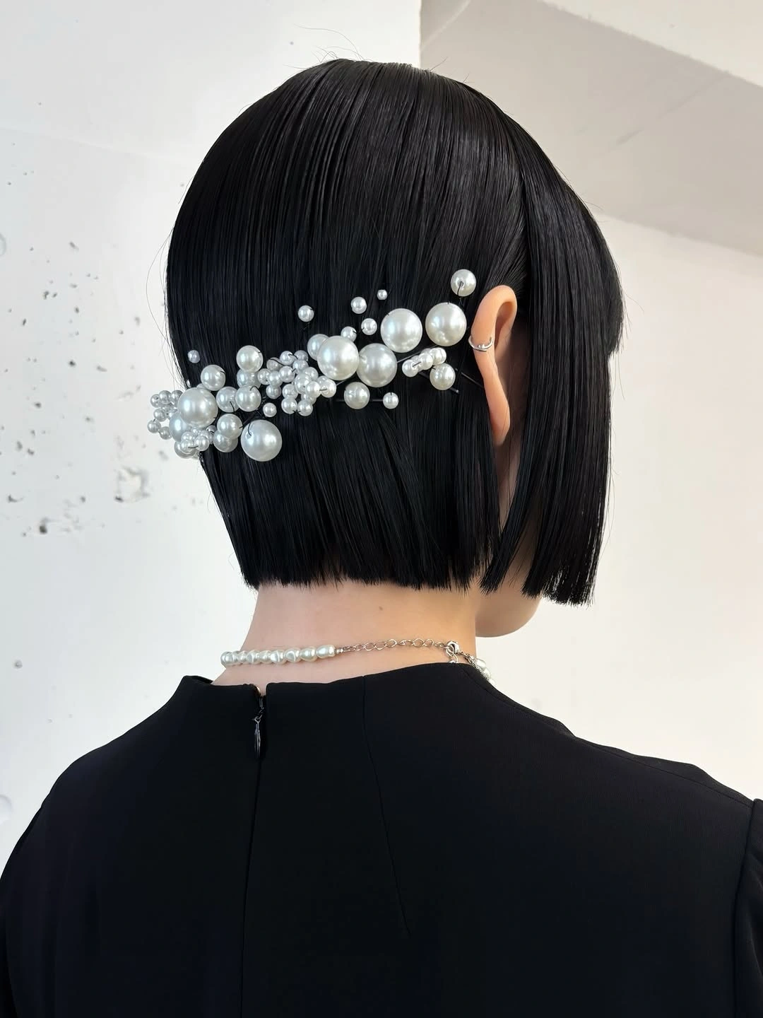 Fall hairstyles for short hair 2026 Glass Bob Styled with a Statement Pearl Barrette