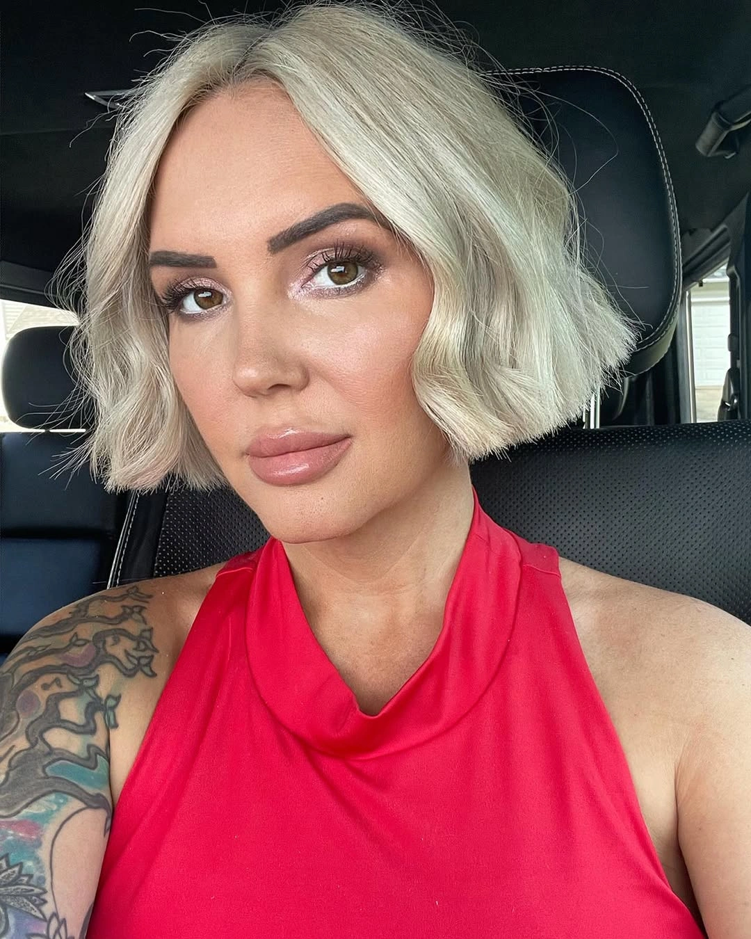Fall hairstyles for short hair 2026 Textured Platinum Wavy Bob with Soft Dimension