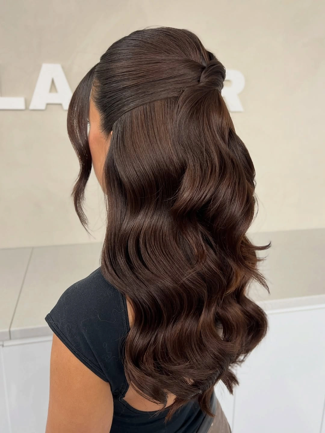 Fall hairstyles for wedding guests 2026 Glossy Half-Up Waves with Seamless Wrapped Detail