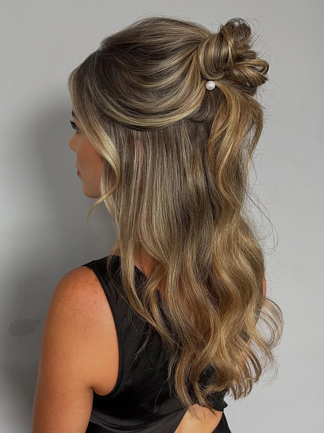 Fall hairstyles for wedding guests 2026 Relaxed Half-Up Twist with Natural Texture