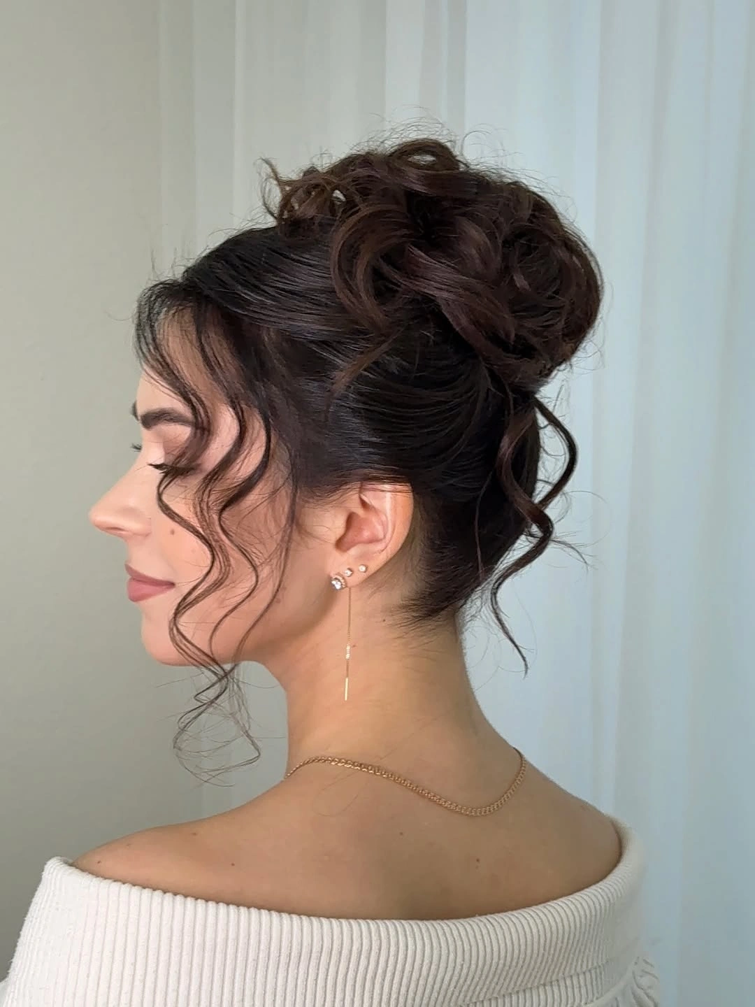 Fall hairstyles for wedding guests 2026 Soft Voluminous Updo with Romantic Face-Framing Curls