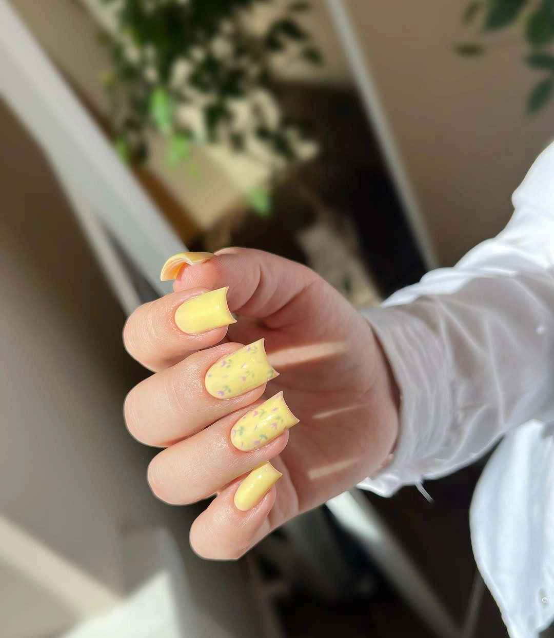soft yellow with pastel floral marks medium square nails with tiny scattered flowers