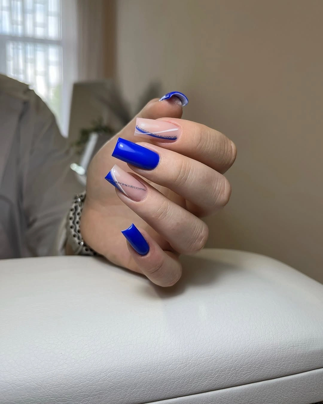 cobalt blue medium square nails with solid blue nails with diagonal line accents