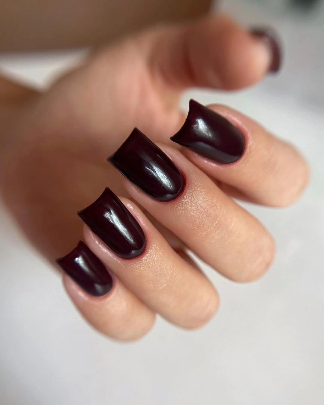 dark wine burgundy medium square with softly rounded sides nails with solid glossy color