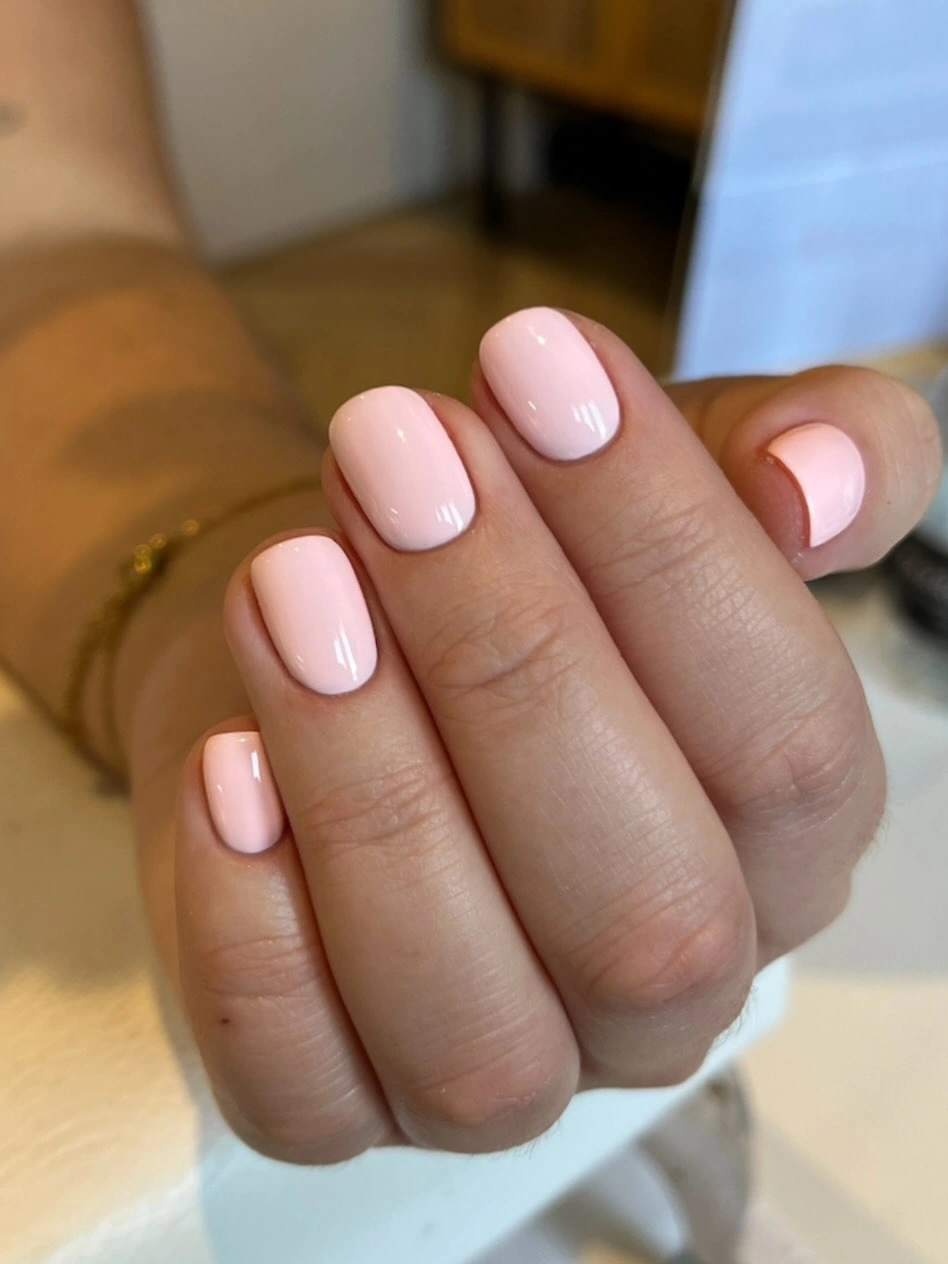 pale milky pink rounded oval-square nails with solid glossy cream