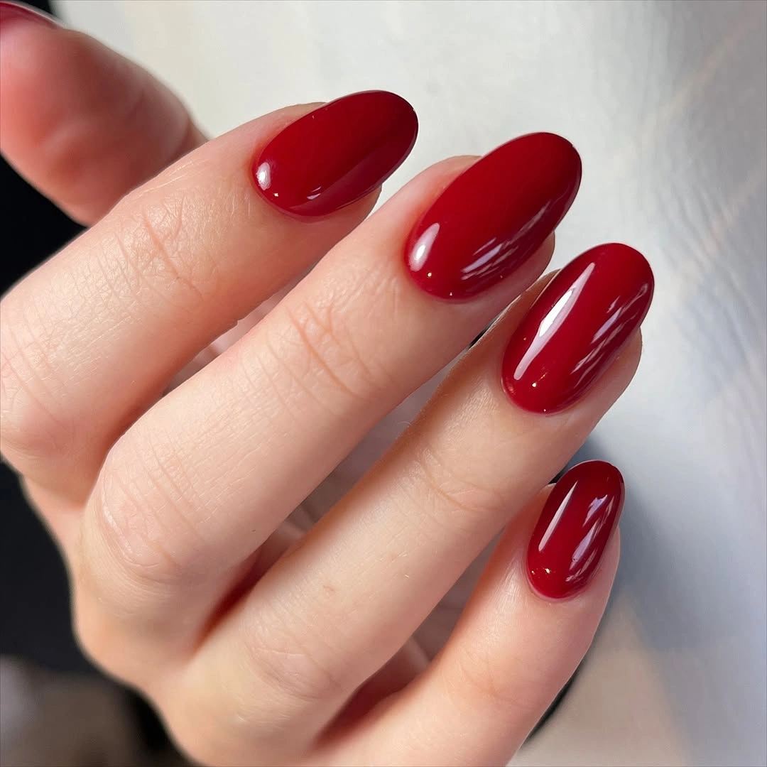 deep red soft almond nails with solid glossy color