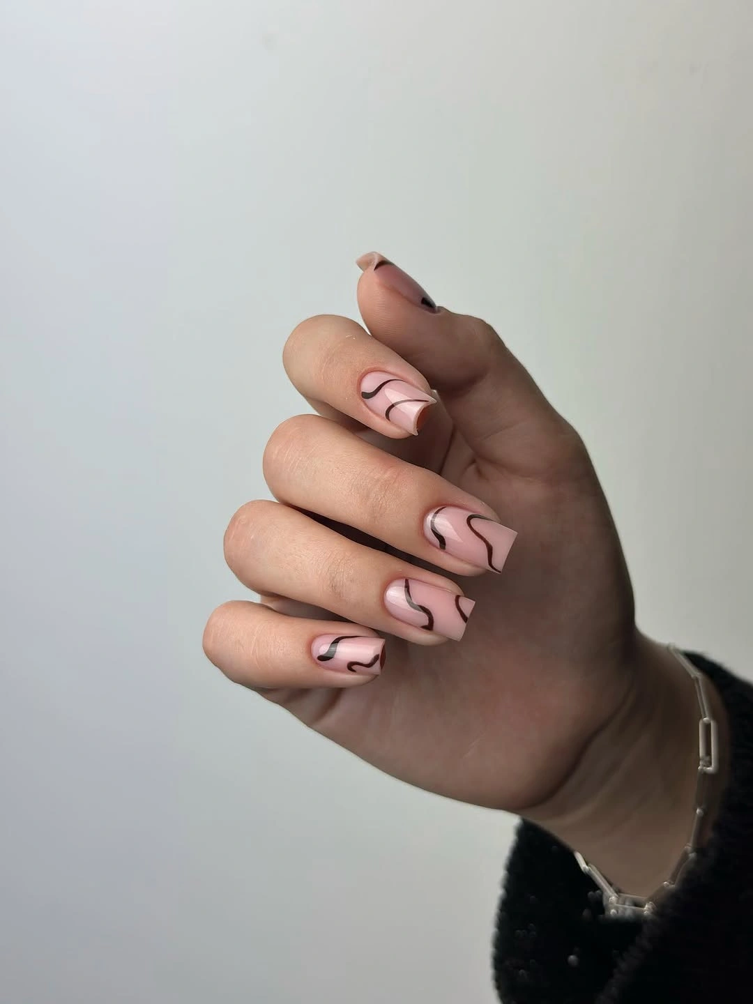 Fall nail art 2026 Nude Swirl Nails With Black French Edges