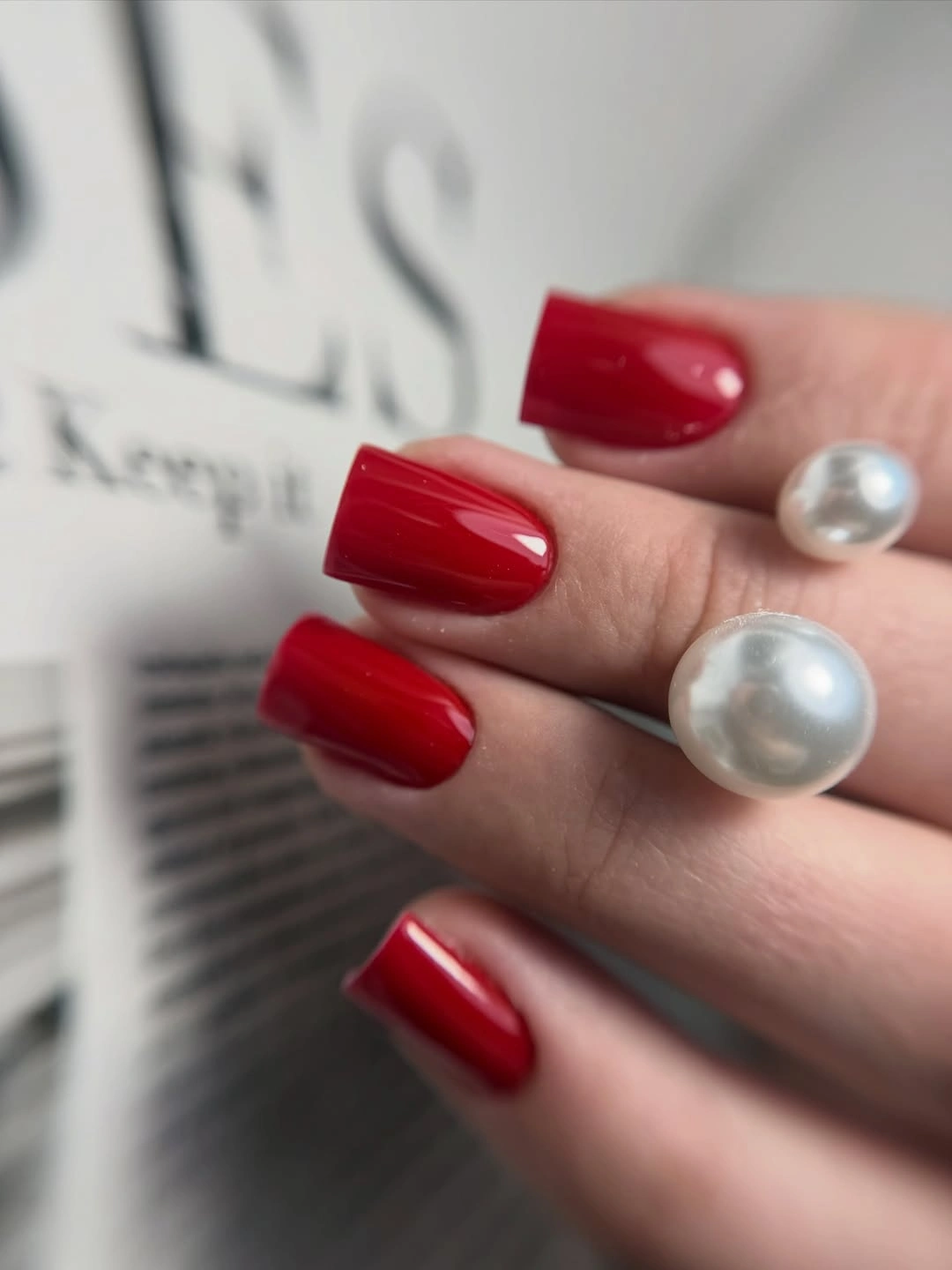 Fall nail art 2026 Glossy Red Square Nails With Pearl Ring Styling