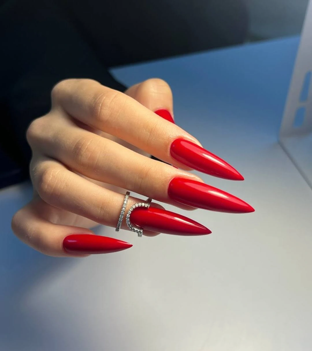 Fall nail art 2026 Sharp Red Stiletto Nails With High Shine
