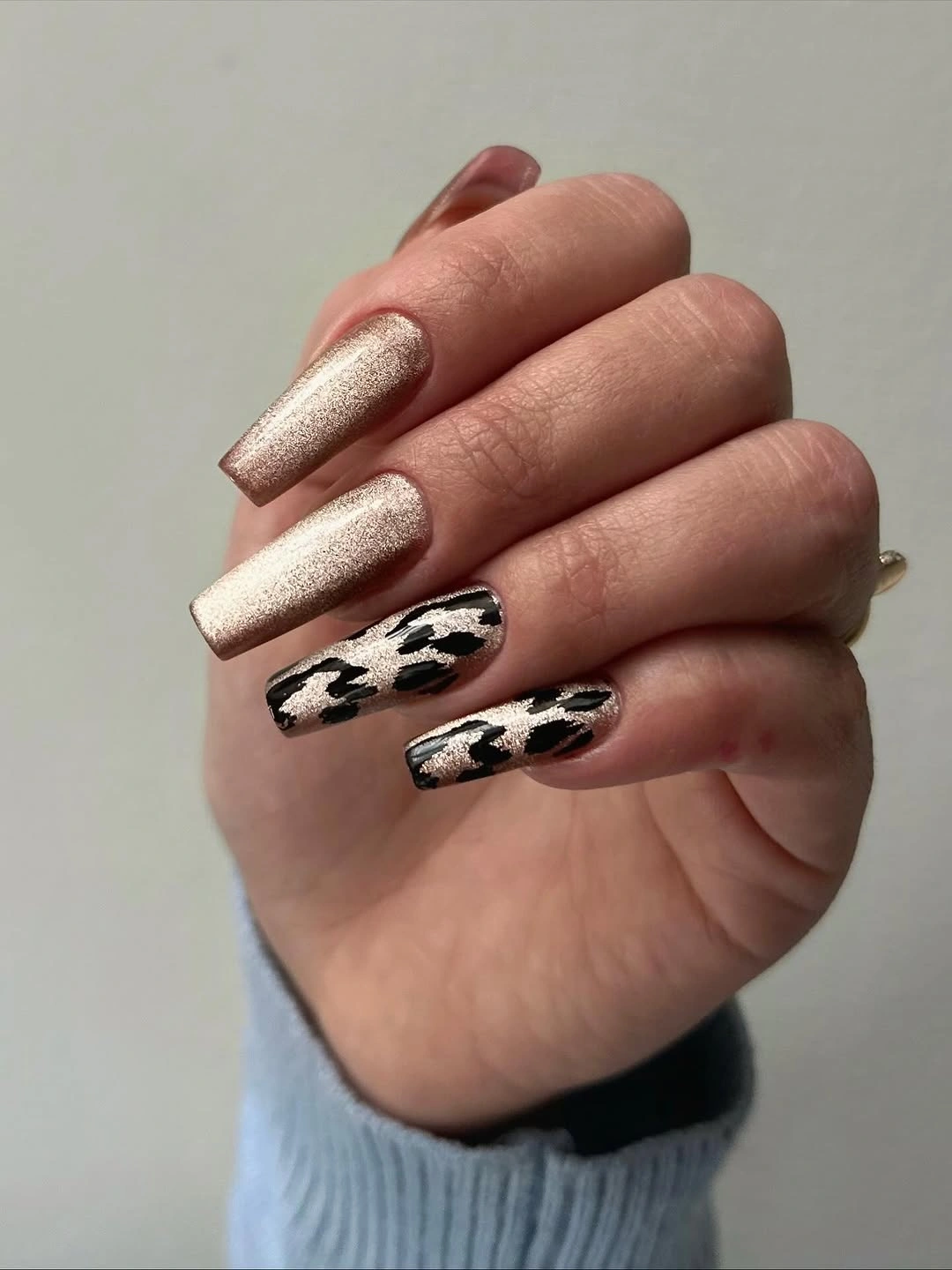 Fall nail art 2026 Champagne Nails With Black Cow-Print Accents