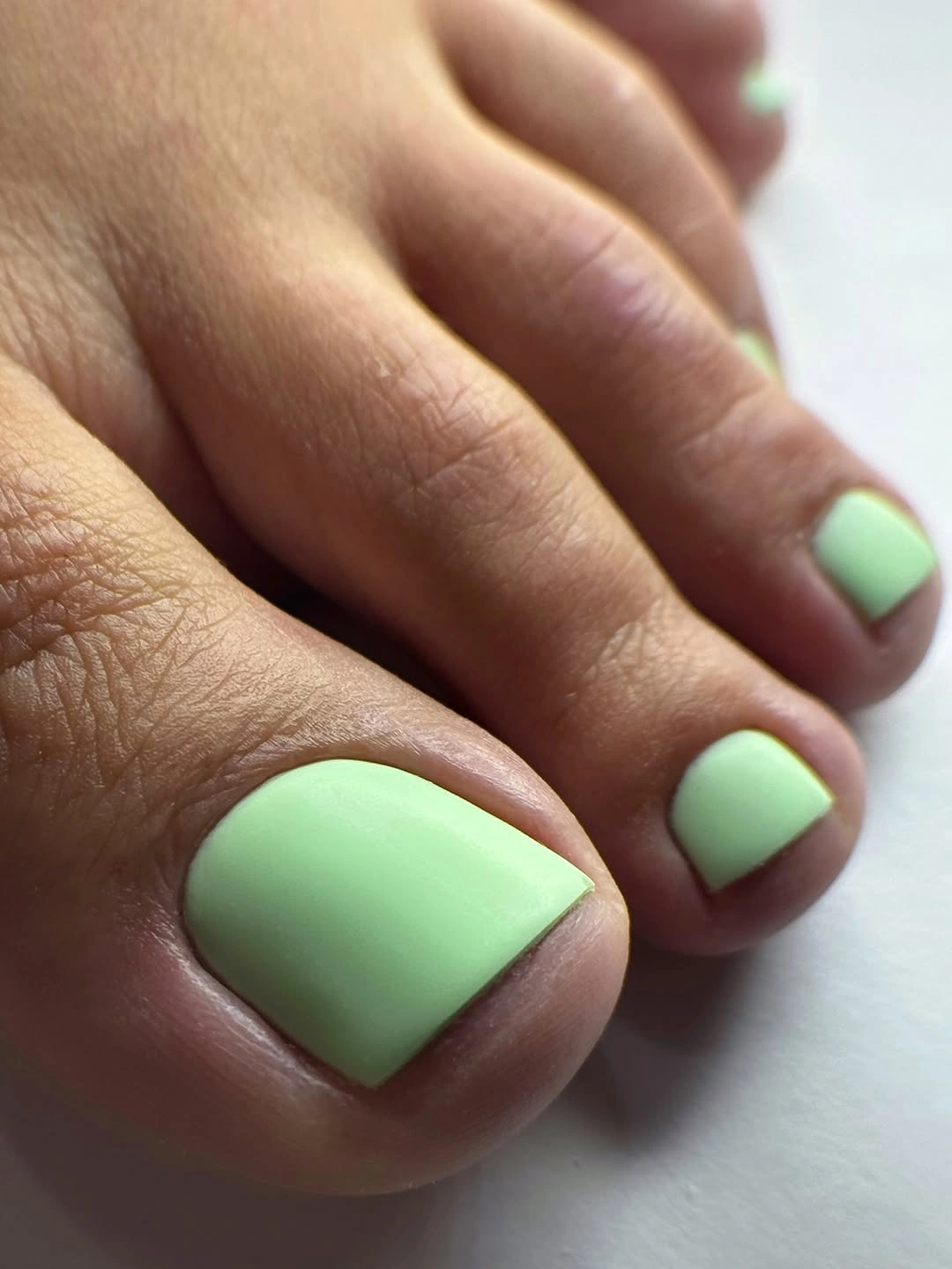 soft mint pedicure on short square toenails