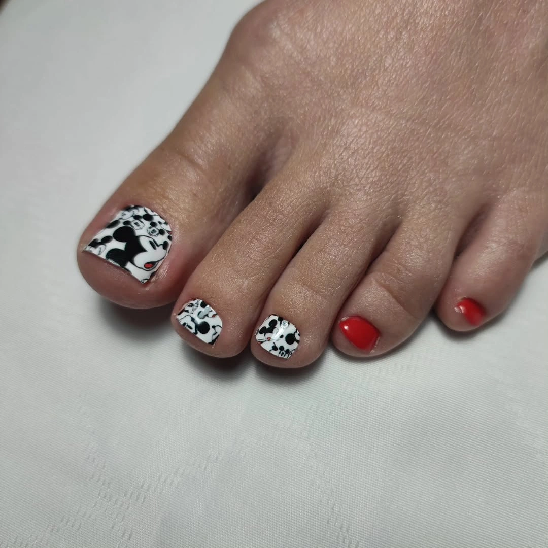 black white and red graphic pedicure design