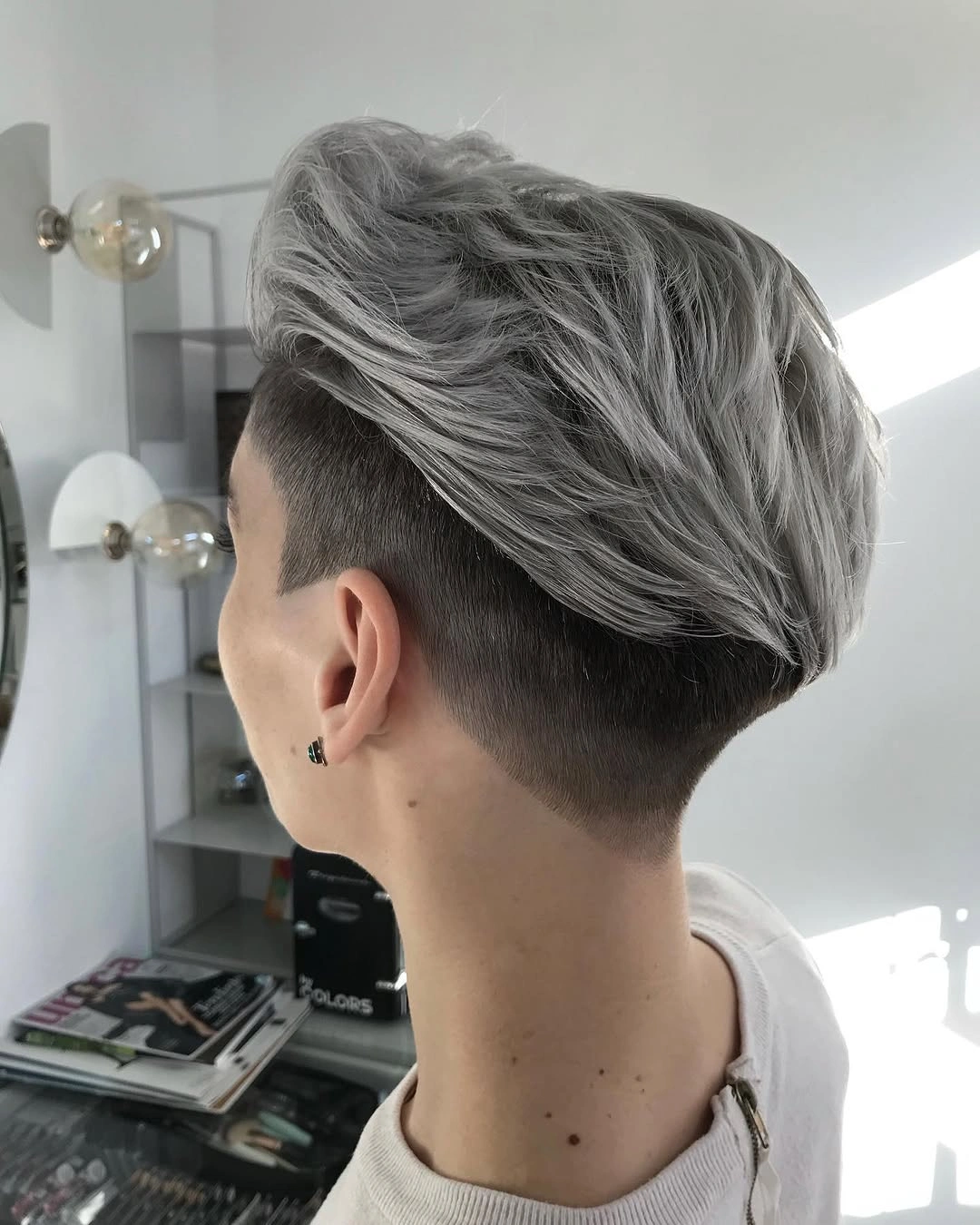 fall pixie haircut ideas 2026 Voluminous Silver Pixie with an Undercut Statement