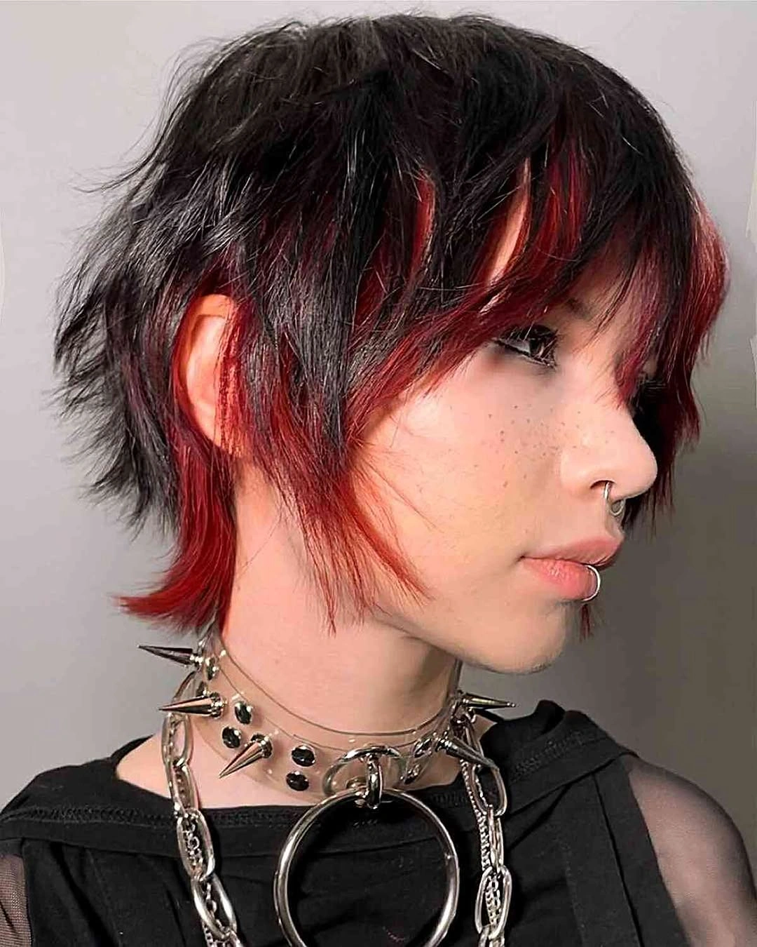 fall pixie haircut ideas 2026 Edgy Black Pixie Mullet with Crimson Highlights