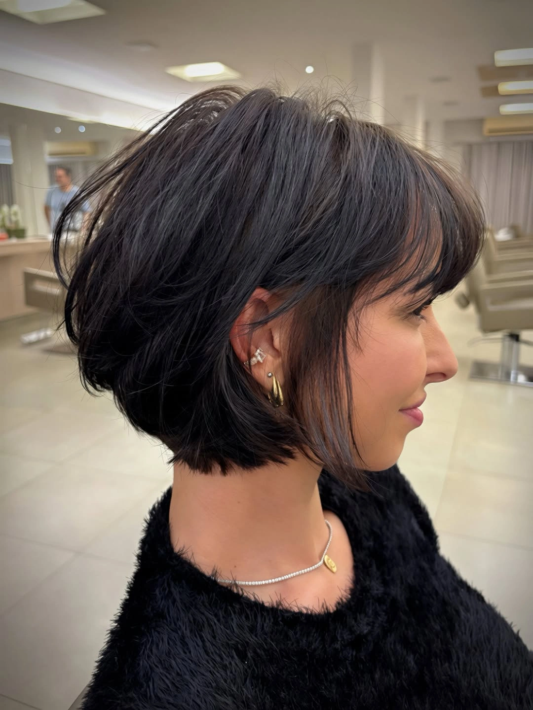 fall short haircuts 2026 Layered Italian Bob with Wispy Bangs