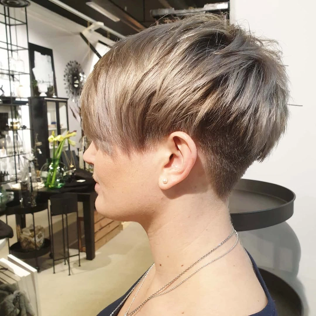 fall short haircuts 2026 Textured Pixie Undercut with Silver Blonde Dimension