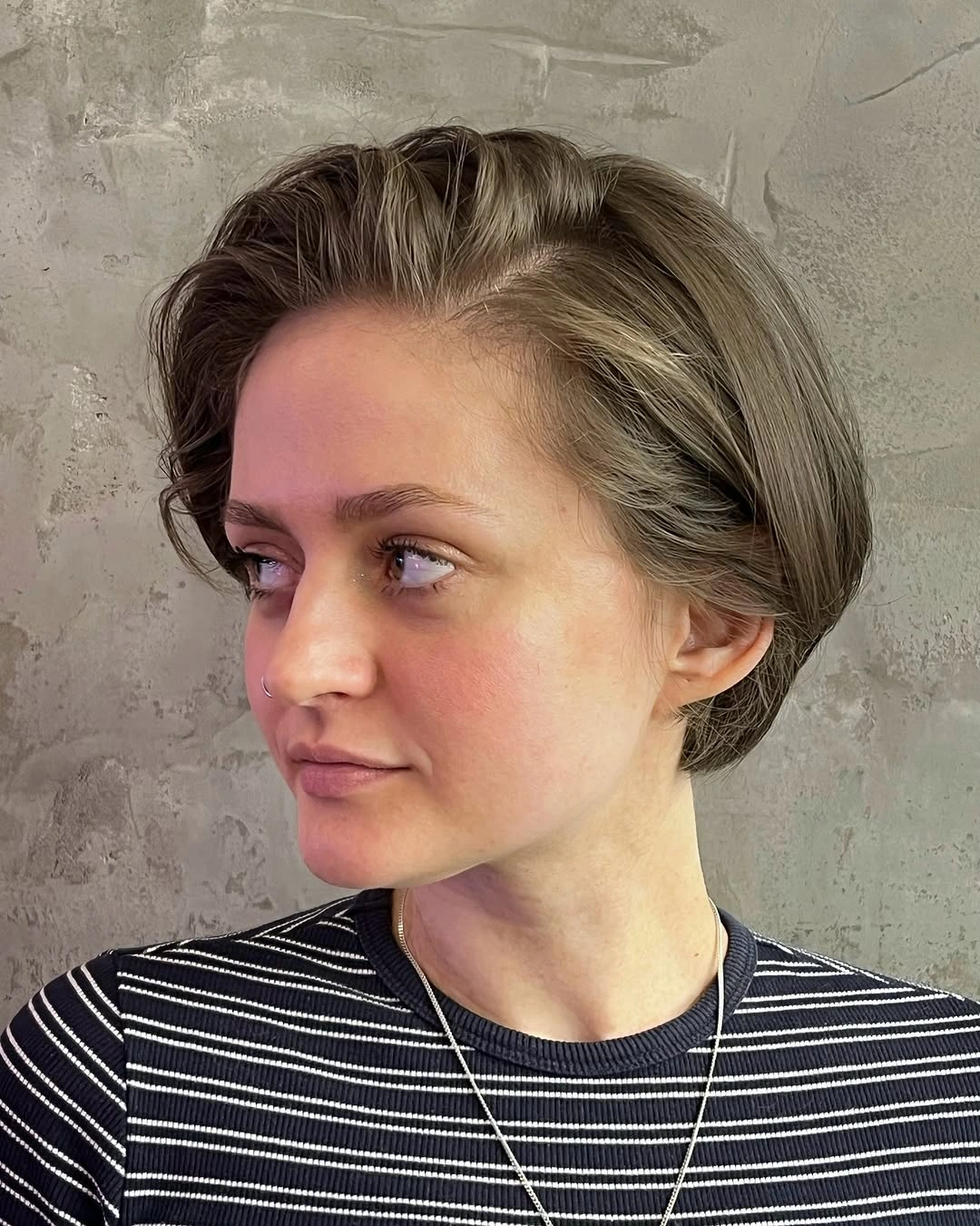fall short haircuts 2026 Sleek Sculpted Pixie Bob with Side Sweep