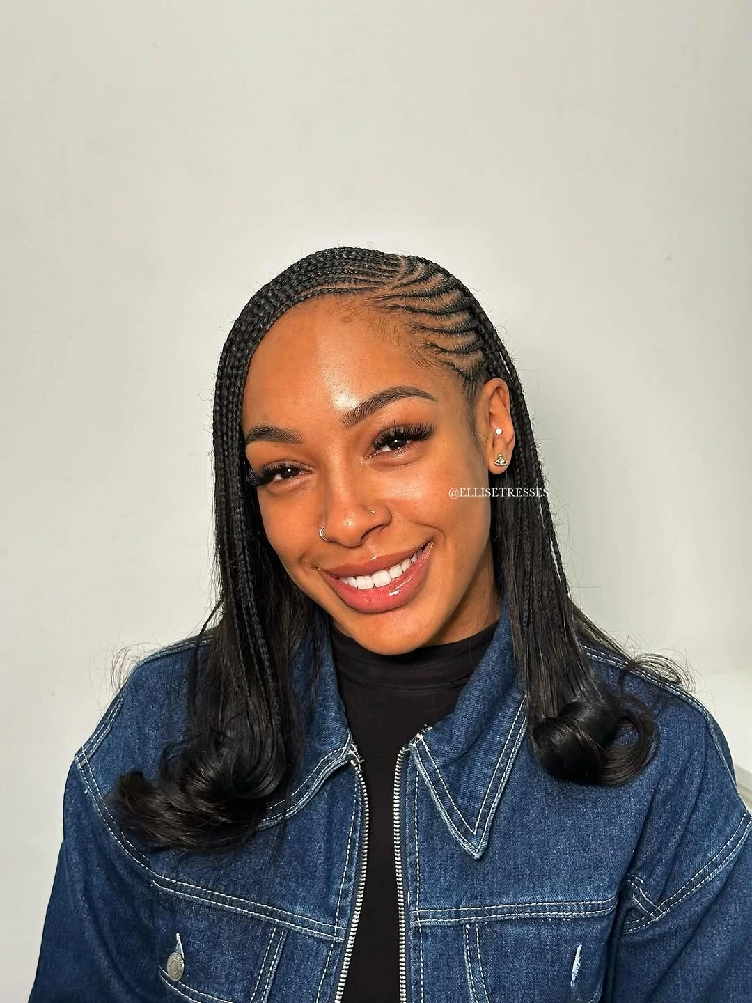 feed in braid hairstyles Side-Swept Feed-In Braids with a Sleek Flipped Finish