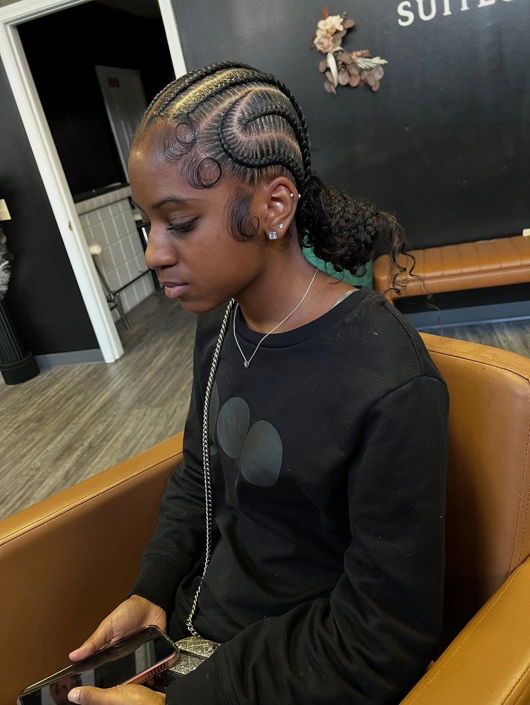 feed in braid hairstyles Elegant Low Bun with Spiral Feed-In Braid Art