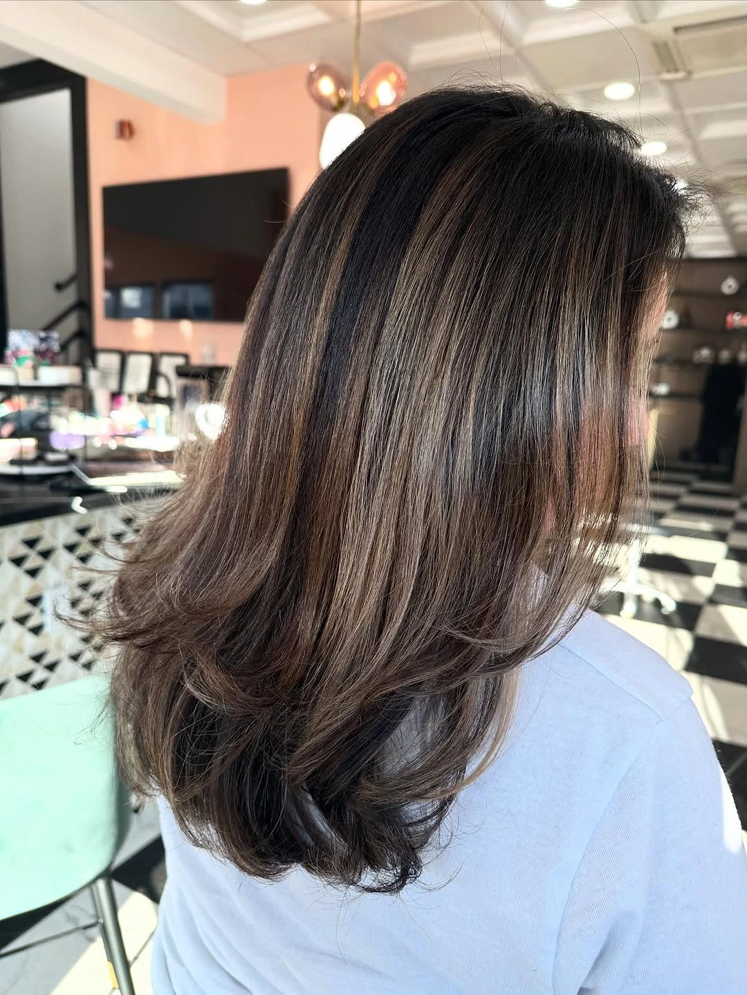 Hair Lowlights: Color Ideas and Inspiration Feathered Layers with Dimensional Cocoa Contrast