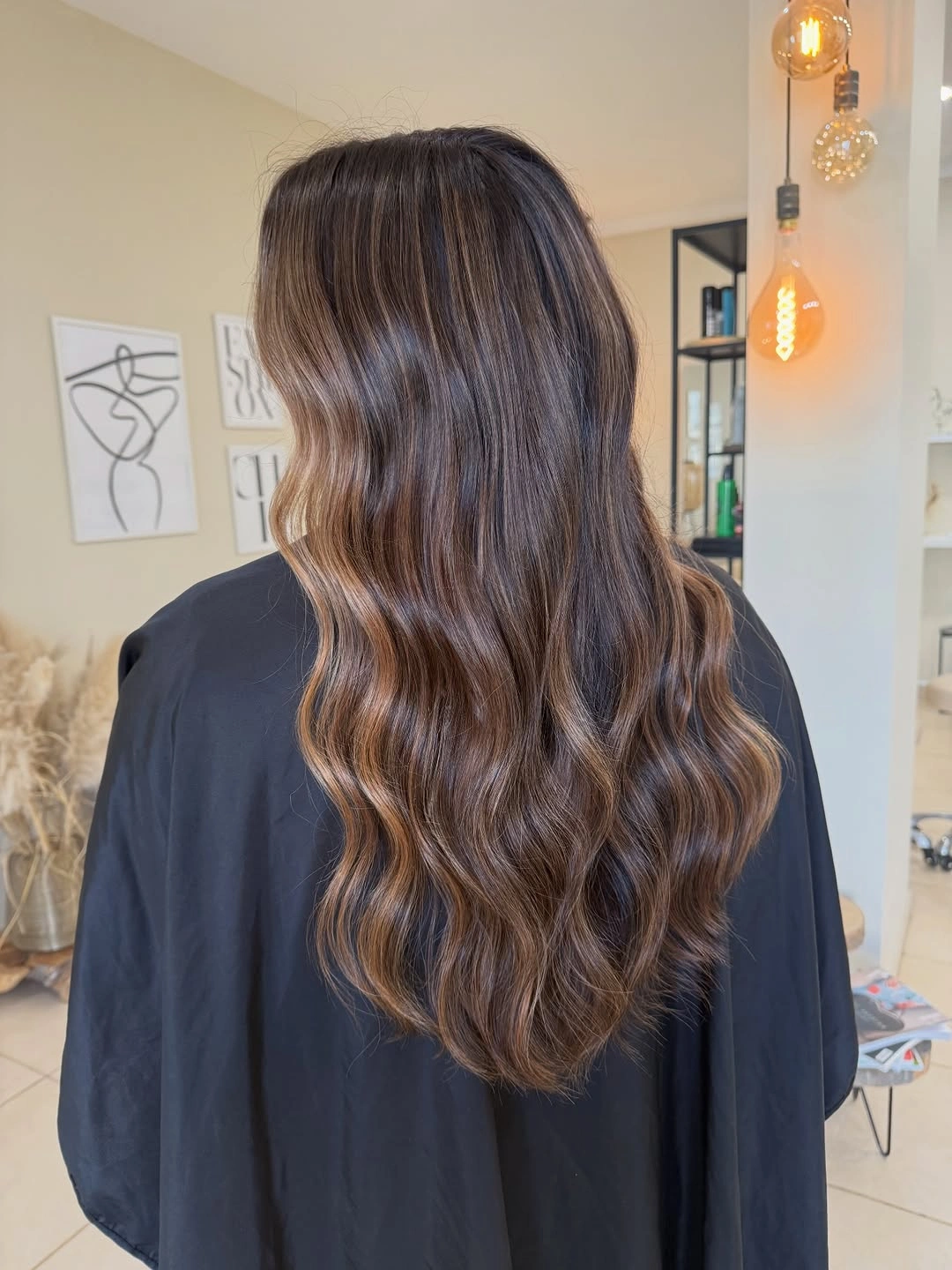 Hair Lowlights: Color Ideas and Inspiration Glossy Chocolate Waves with Barely-There Cinnamon Ribbons