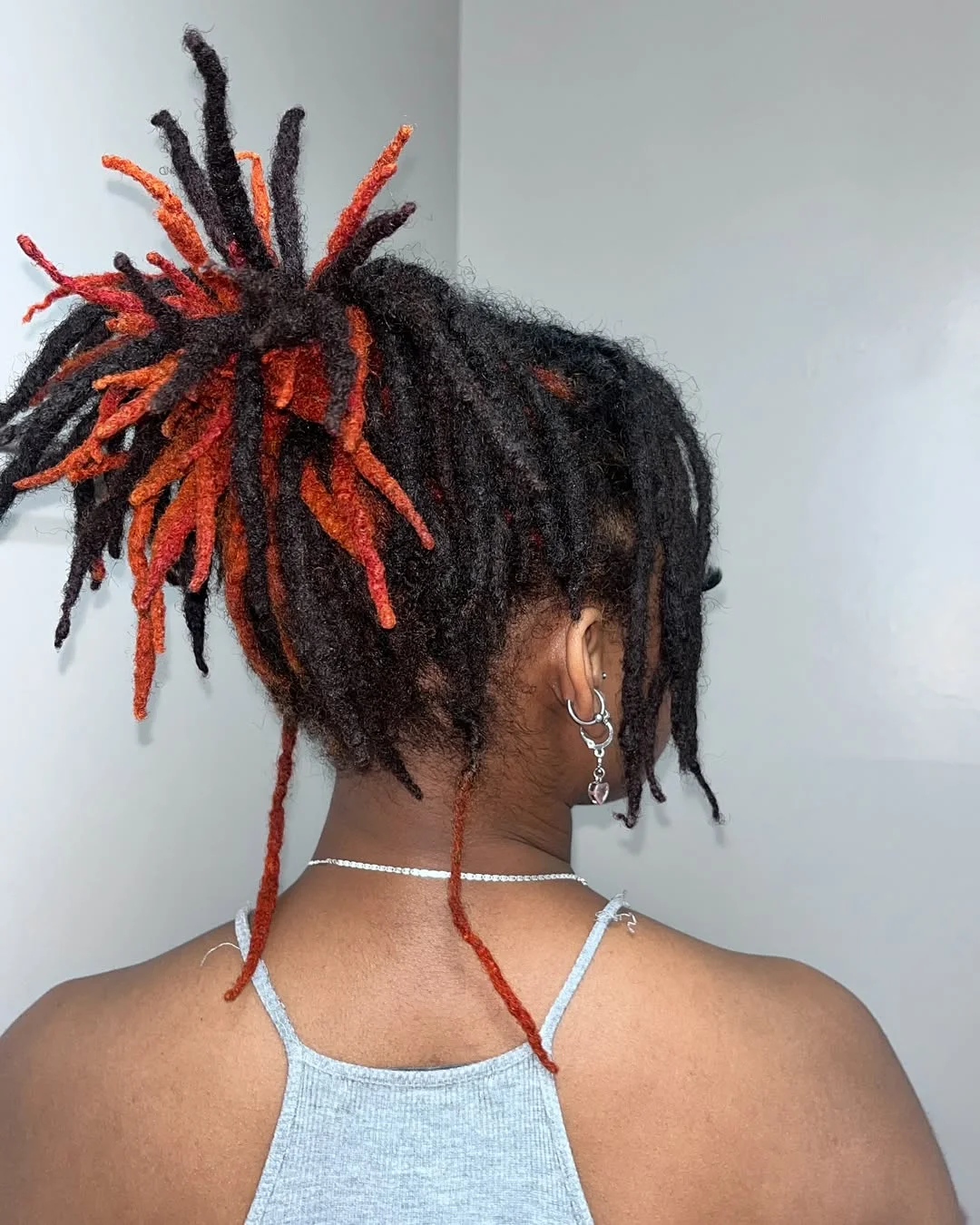 locs hairstyles for black women High Ponytail Locs With Fiery Copper Highlights