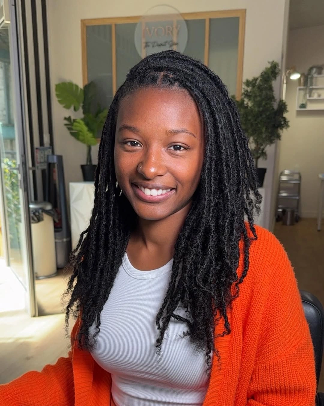 locs hairstyles for black women Natural Mid-Length Locs With Soft Layered Movement