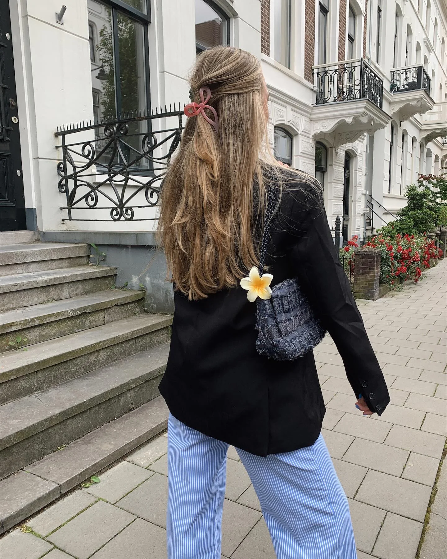 September fashion trends 2026 Black Blazer With Pale Blue Trousers From Back
