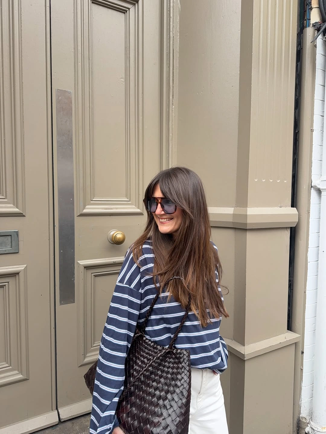 September fashion trends 2026 Navy Stripes With White Pants And Pattern Bag