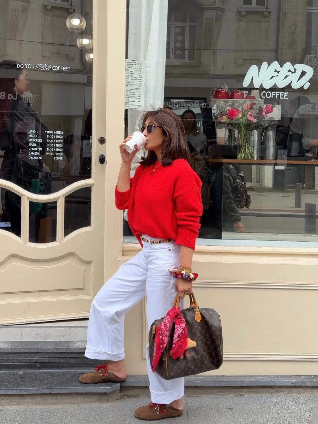 September fashion trends 2026 Red Sweater With White Jeans And Printed Bag