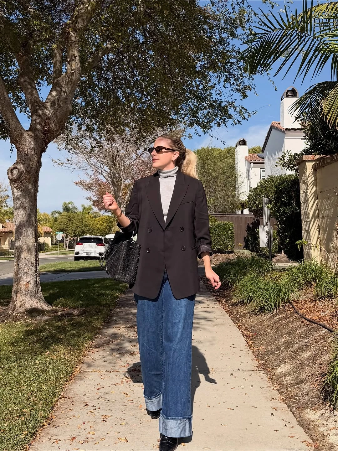 September fashion trends 2026 Black Blazer With Cuffed Blue Jeans